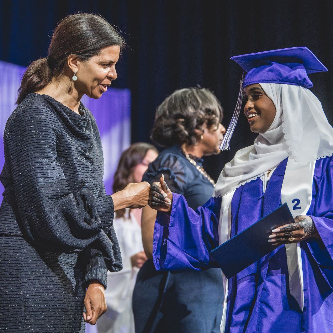  Dr. Logan congratulating a student at graduation.